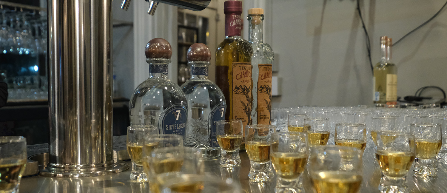 Glasses of tequila set out for the tasting.